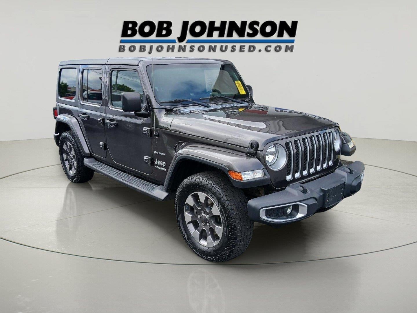 2018 Jeep Wrangler Sahara in Granite Crystal Metallic Clearcoat — front three-quarter view