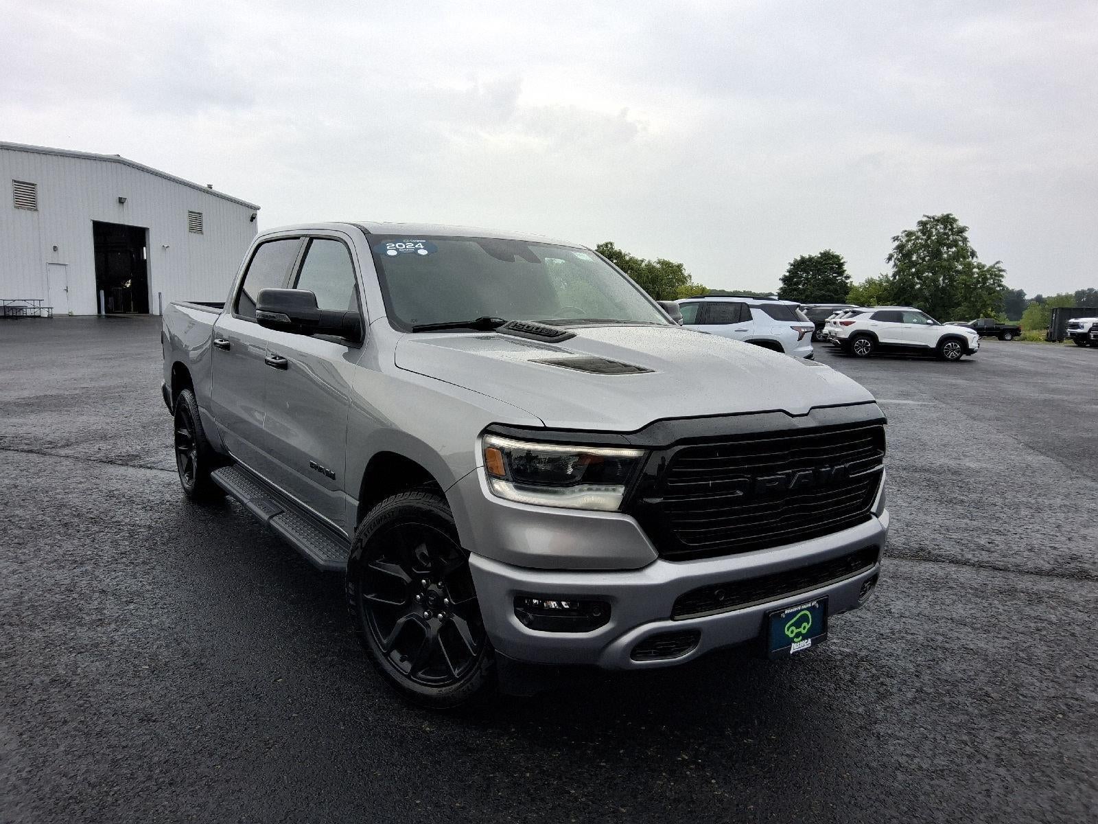 2023 RAM 1500 Laramie Crew Cab 4x4 5'7" Box in Silver — front three-quarter view