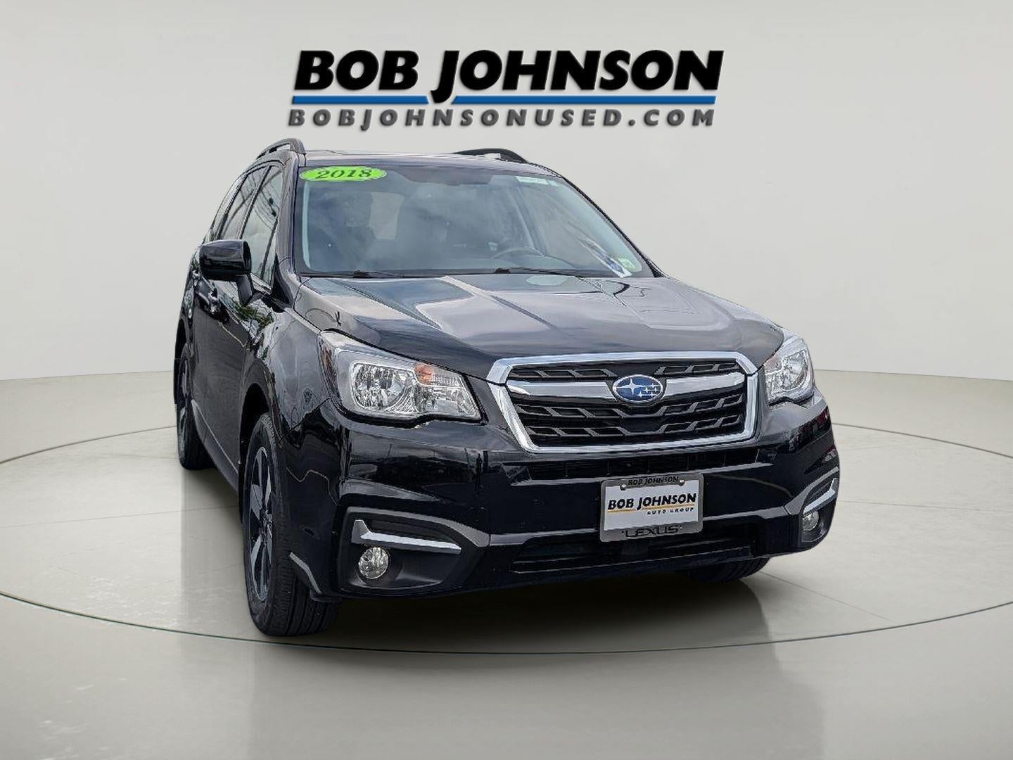 2018 Subaru Forester Limited in Crystal Black Silica — front three-quarter view