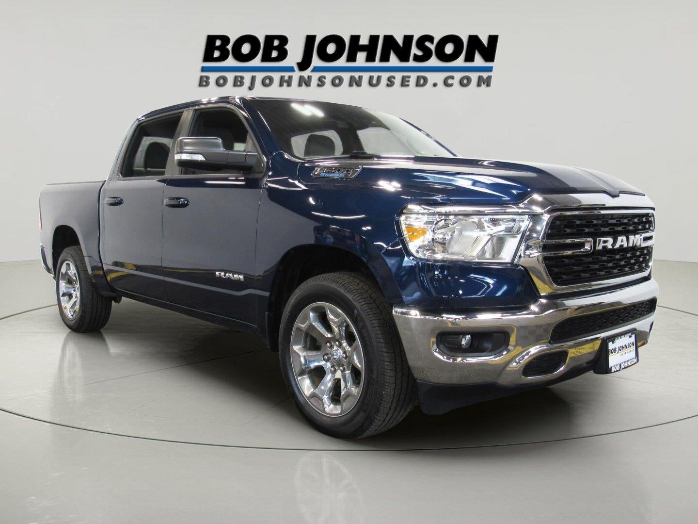 2022 RAM 1500 Big Horn Crew Cab 4x4 5'7' Box in Patriot Blue Pearlcoat — front three-quarter view
