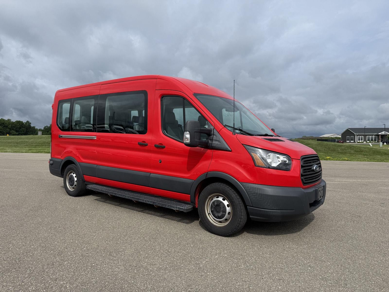 2018 Ford Transit Passenger Wagon XL in Race Red — front three-quarter view