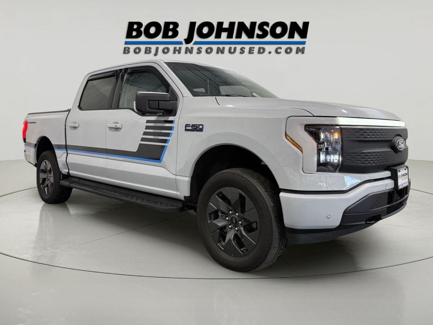 2025 Ford F-150 Lightning Flash in Space White Metallic — front three-quarter view