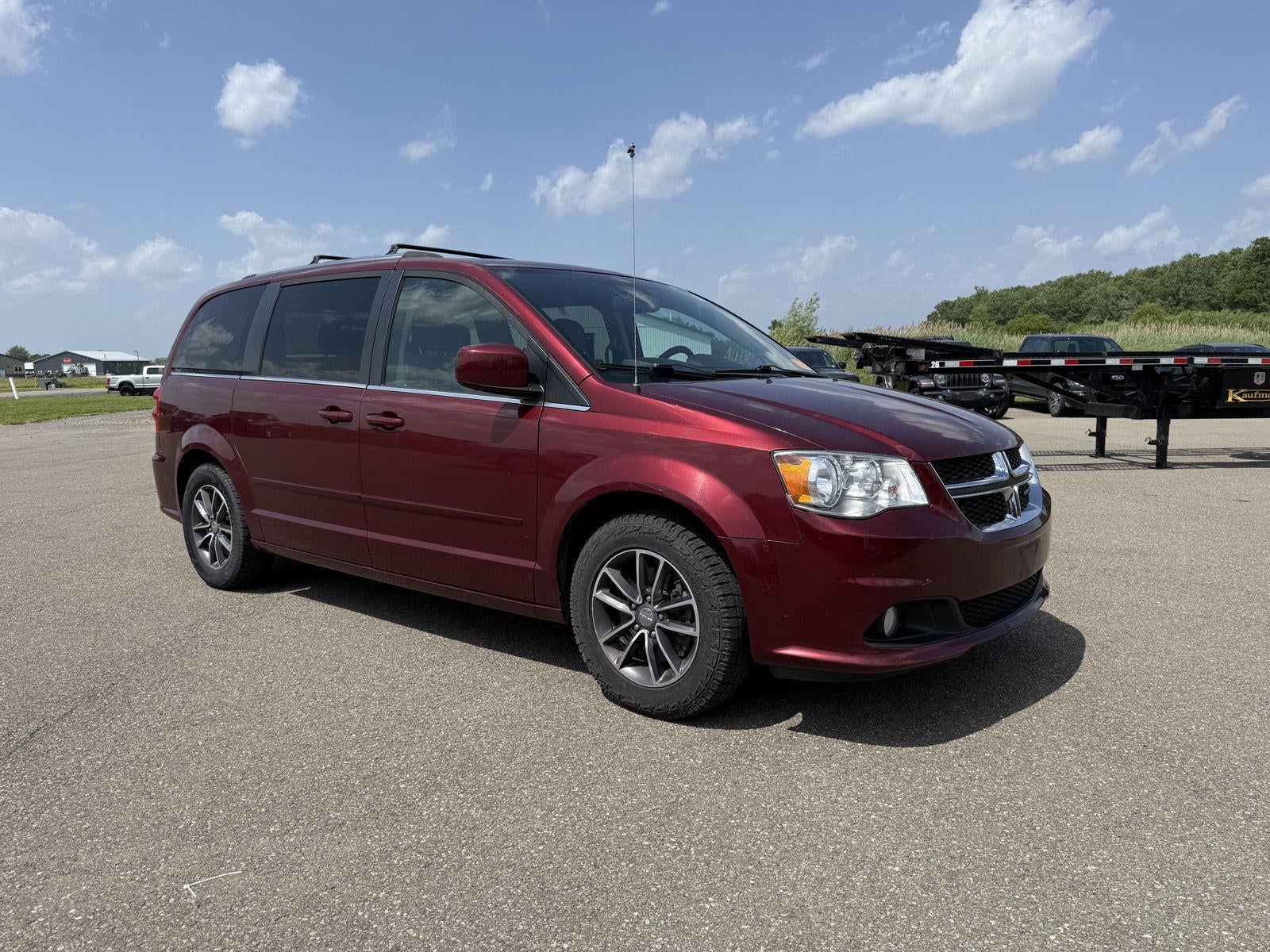 2017 Dodge Grand Caravan SXT in Octane Red Pearlcoat — front three-quarter view