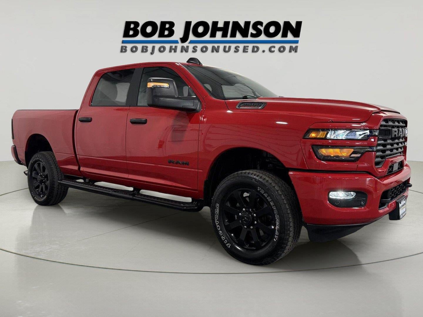 2026 RAM 2500 Big Horn in Flame Red Clearcoat — front three-quarter view