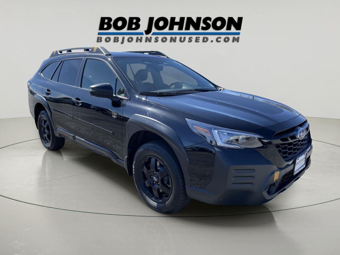 2023 Subaru Outback Wilderness in Crystal Black Silica — front three-quarter view