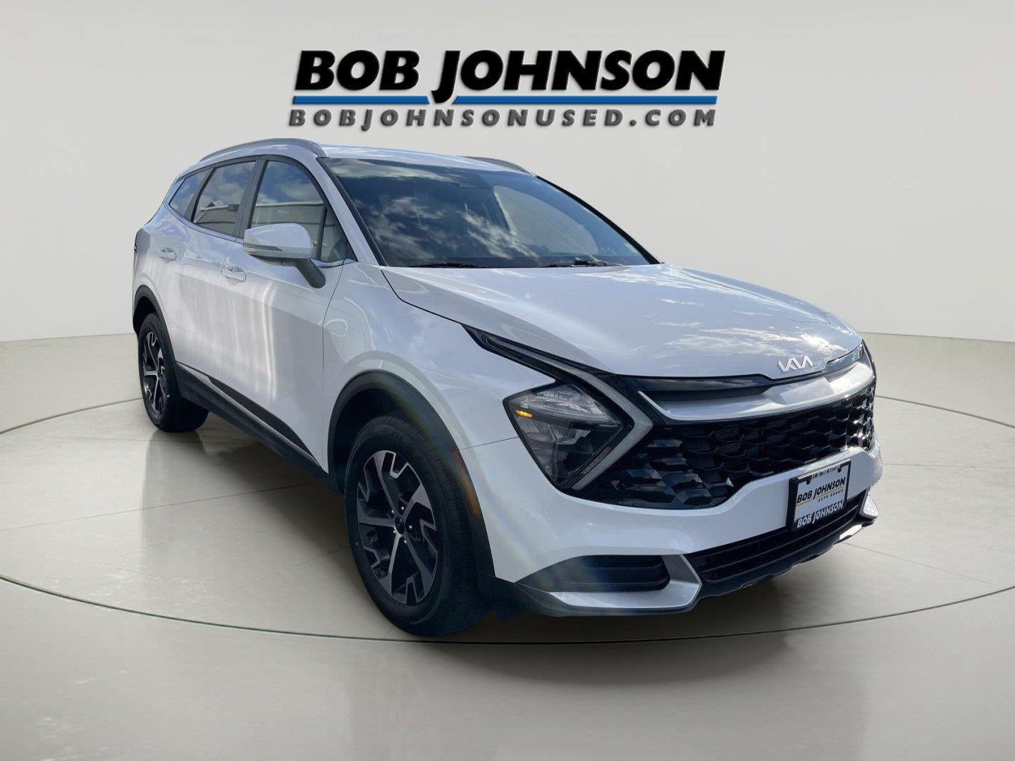 2023 Kia Sportage EX in Glacial White Pearl — front three-quarter view