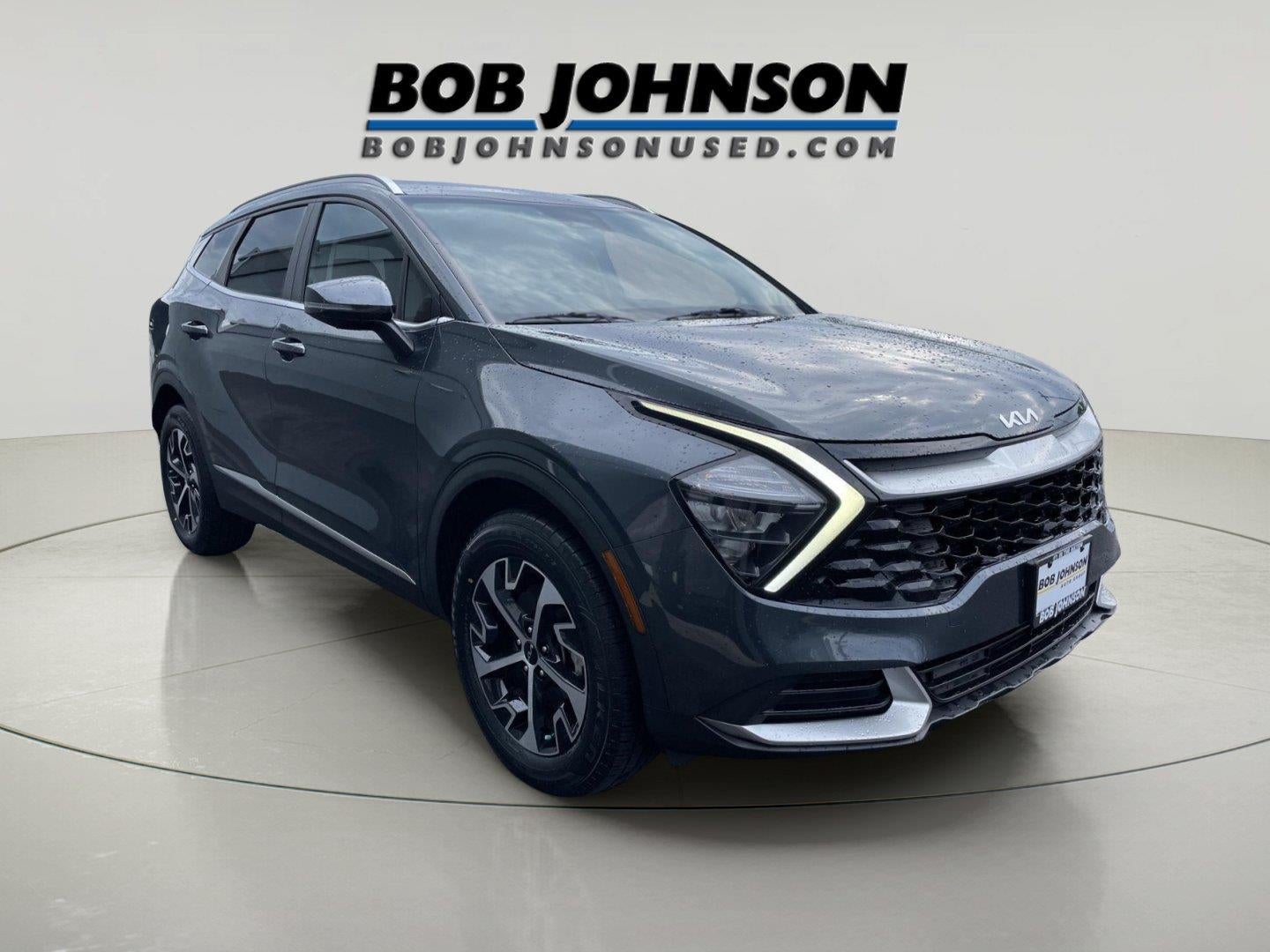 2023 Kia Sportage Hybrid EX in Gravity Gray — front three-quarter view